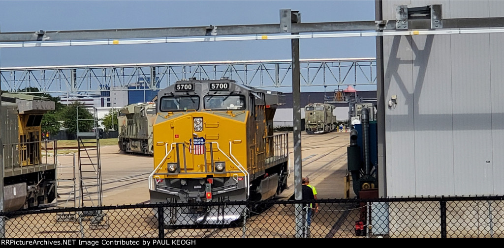 UP 5700 A Brand New Undelivered C44ACM Locomotive sits on The Wabtec Track Next to The Factory with 3 Brand New BNSF ET44ACH's Tier 4's in Primer to the Left and Right of Her In The Background.